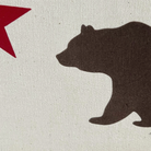 Close-up of California Republic Pennant Flag with canvas material, showing bear and red star design details.